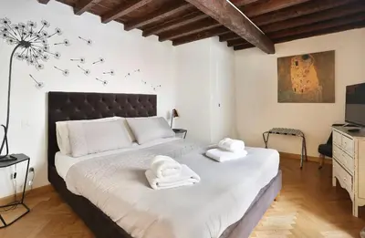 Letto o letti in una camera di Residenza Vasariano