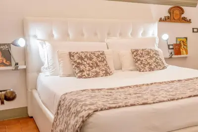 Letto o letti in una camera di Tintori art loft