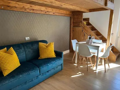 Area soggiorno di Flo Liberta’ Suite Wood