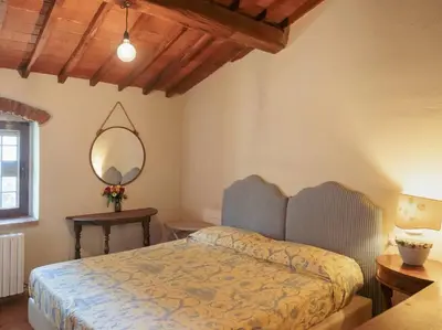 Letto o letti in una camera di Villa Peramonda