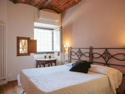 Letto o letti in una camera di Villa Peramonda