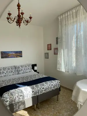 Letto o letti in una camera di Roby Apartment in centro 3 camere 3 bagni