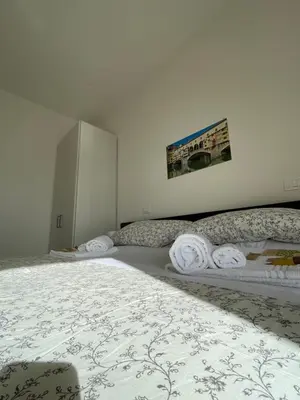 Letto o letti in una camera di Roby Apartment in centro 3 camere 3 bagni