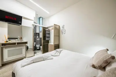Letto o letti in una camera di Rifugio99 Firenze - The Heart of Oltrarno