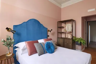 Letto o letti in una camera di Santarosa Rooms