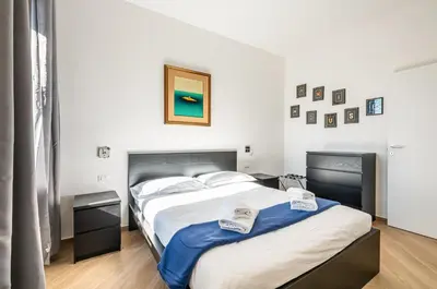 Letto o letti in una camera di GuestHost - Charming Hideaway in Florence - Apt x4