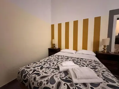 Letto o letti in una camera di Residenza Dante, Firenze