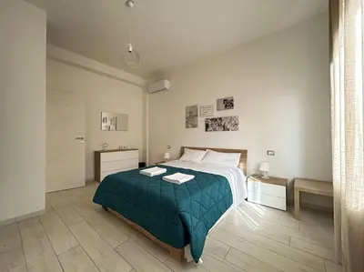 Letto o letti in una camera di Dante Apartment by FlorenceHospitality com