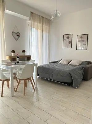 Letto o letti in una camera di Dante Apartment by FlorenceHospitality com
