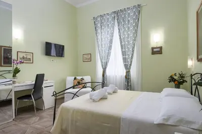 Letto o letti in una camera di CADORNA Rooms in Florence