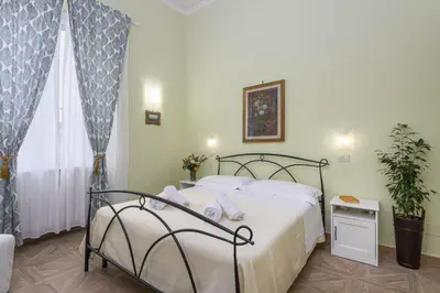 Letto o letti in una camera di CADORNA Rooms in Florence