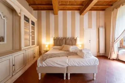 Letto o letti in una camera di Keys of Italy - Ghib 80 Big e Room - 2 apt in via Ghibellina