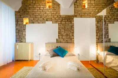 Letto o letti in una camera di Keys of Italy - Borgo SSApo 13 - Deluxe 2 Family Apts by Ponte Vecchio