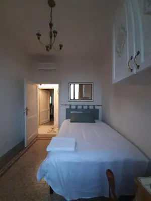 Letto o letti in una camera di Mary&Flo House - A due passi dal centro - free private parking