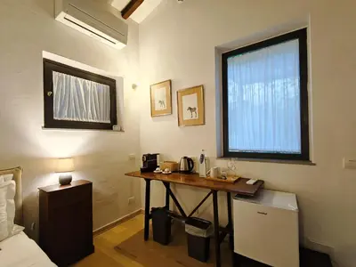 Letto o letti in una camera di Cortile Santa Monaca
