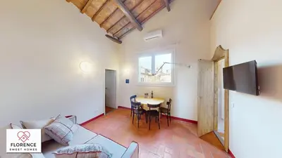 TV o dispositivi per l'intrattenimento presso Santa Croce Historical Apartment by Florence Sweet Homes