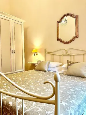 Letto o letti in una camera di B&B Casa Moscato Firenze