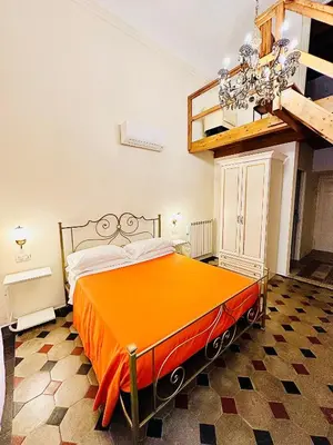 Letto o letti in una camera di B&B Casa Moscato Firenze