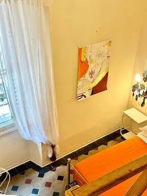 Letto o letti in una camera di B&B Casa Moscato Firenze