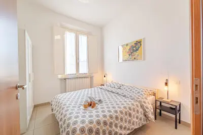 Letto o letti in una camera di Mosse Bridge Apartment by Mamo Florence