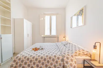 Letto o letti in una camera di Mosse Bridge Apartment by Mamo Florence