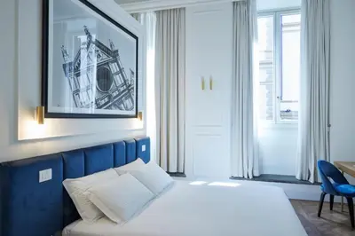 Letto o letti in una camera di Suite Residenza Quartieri Storici Duomo