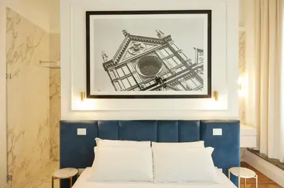 Letto o letti in una camera di Suite Residenza Quartieri Storici Duomo