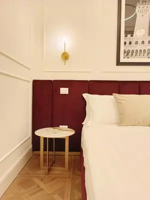 Letto o letti in una camera di Suite Residenza Quartieri Storici Duomo