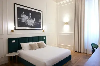 Letto o letti in una camera di Suite Residenza Quartieri Storici Duomo
