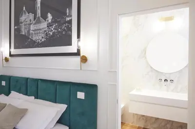 Letto o letti in una camera di Suite Residenza Quartieri Storici Duomo