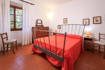 Letto o letti in una camera di Agriturismo Fattoria di Sommaia