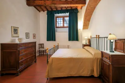 Letto o letti in una camera di Agriturismo Fattoria di Sommaia