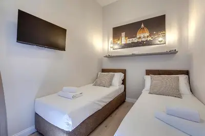 Letto o letti in una camera di San Gallo 23 APT