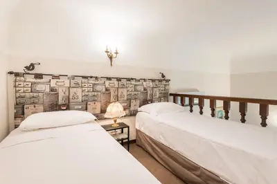 Letto o letti in una camera di Calzaiuoli Adapartments Collection