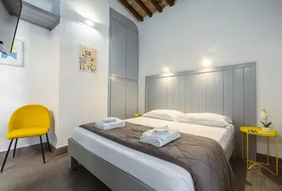 Letto o letti in una camera di Le Casine Firenze