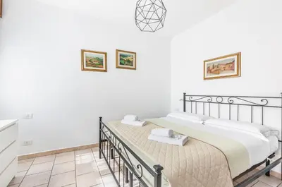 Letto o letti in una camera di GuestHost - La Nicchia dei Papi - Visarno Arena Lovely Apt