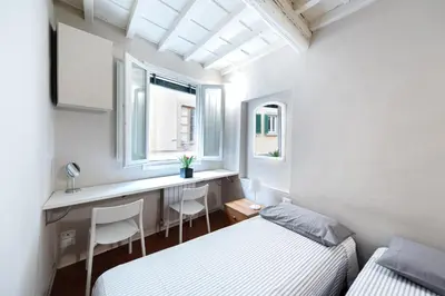 Letto o letti in una camera di Appartamento nel cuore dell'Oltrarno