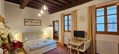 Letto o letti in una camera di Il Loft degli Albizi