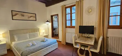 Letto o letti in una camera di Il Loft degli Albizi