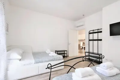 Letto o letti in una camera di Wine Apartments Florence Bardolino