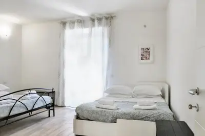 Letto o letti in una camera di Wine Apartments Florence Bardolino