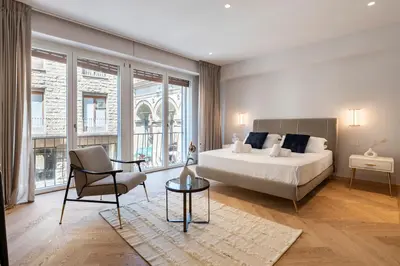 Letto o letti in una camera di The Old Palace- Luxury Suites Signoria
