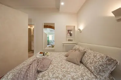 Letto o letti in una camera di Fossi - Flo Apartments