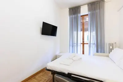 Letto o letti in una camera di Appartamento76