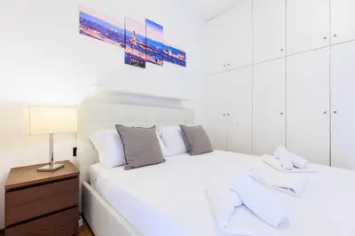 Letto o letti in una camera di Appartamento76