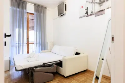 Letto o letti in una camera di Appartamento76
