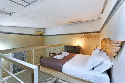 Letto o letti in una camera di L'Affresco - Relais in Santo Spirito