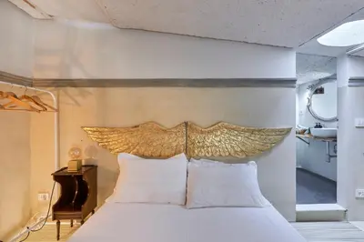 Letto o letti in una camera di L'Affresco - Relais in Santo Spirito