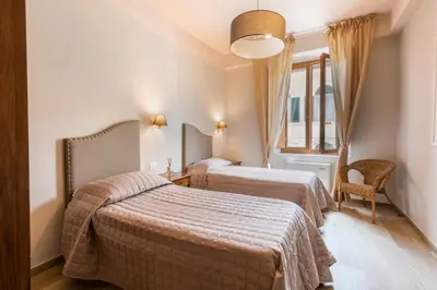Letto o letti in una camera di Apartments Florence - Ariento Giuditta 2 bdr