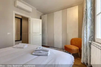 Letto o letti in una camera di Bice & Krizia Apartments by Mamo Florence